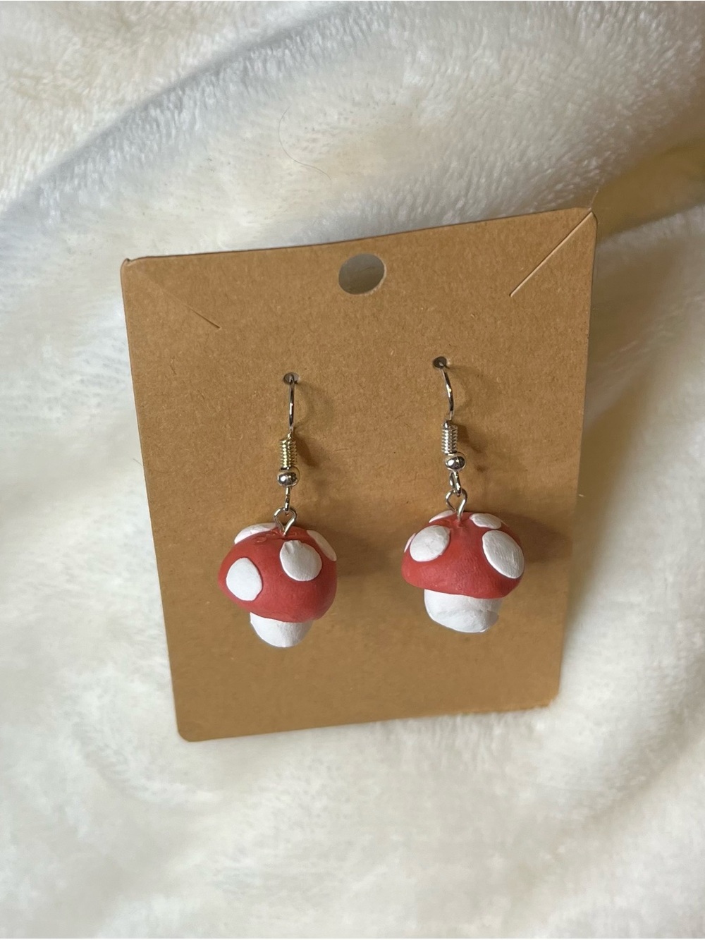 Super Mario-inspired Handmade mushroom dangle earrings.